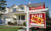 SOLD sign in front of house