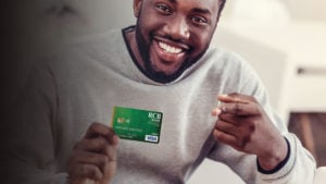 man holding a debit card